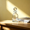 Flacon de parfum en verre transparent avec bouchon rond pour usage aromathérapie à domicile